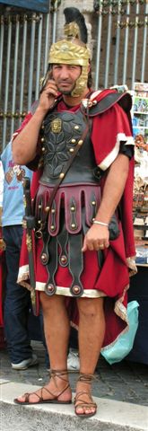 A Roman soldier using his cell phone ... no doubt calling out the gladiators